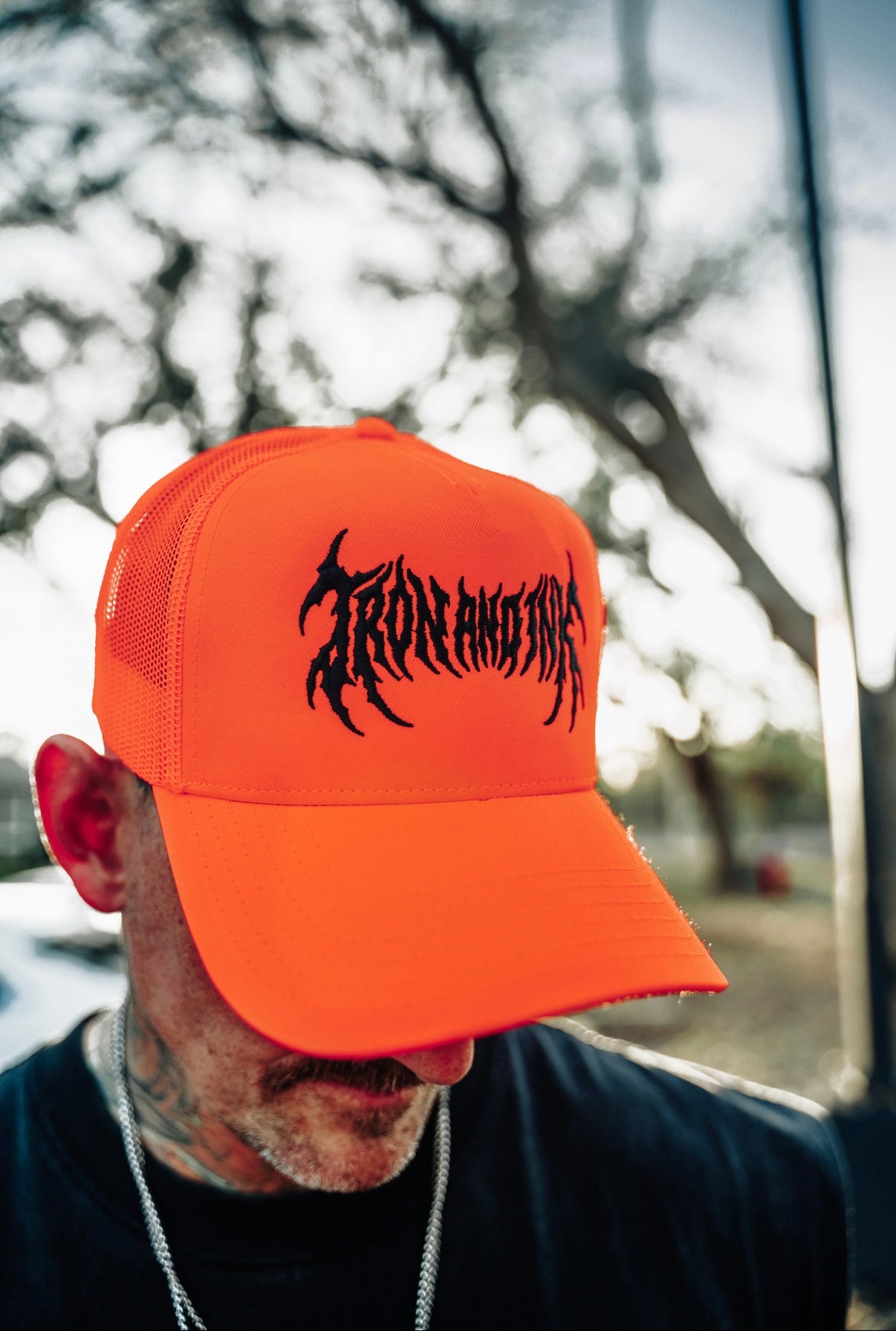 metal font blaze Orange trucker hat
